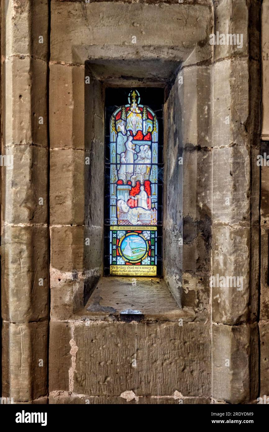 Stained glass window set in an alcove at Holy Trinity Church Stratford upon Avon England UK Stock Photo
