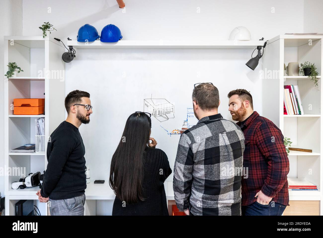 Architects working on white board in office Stock Photo