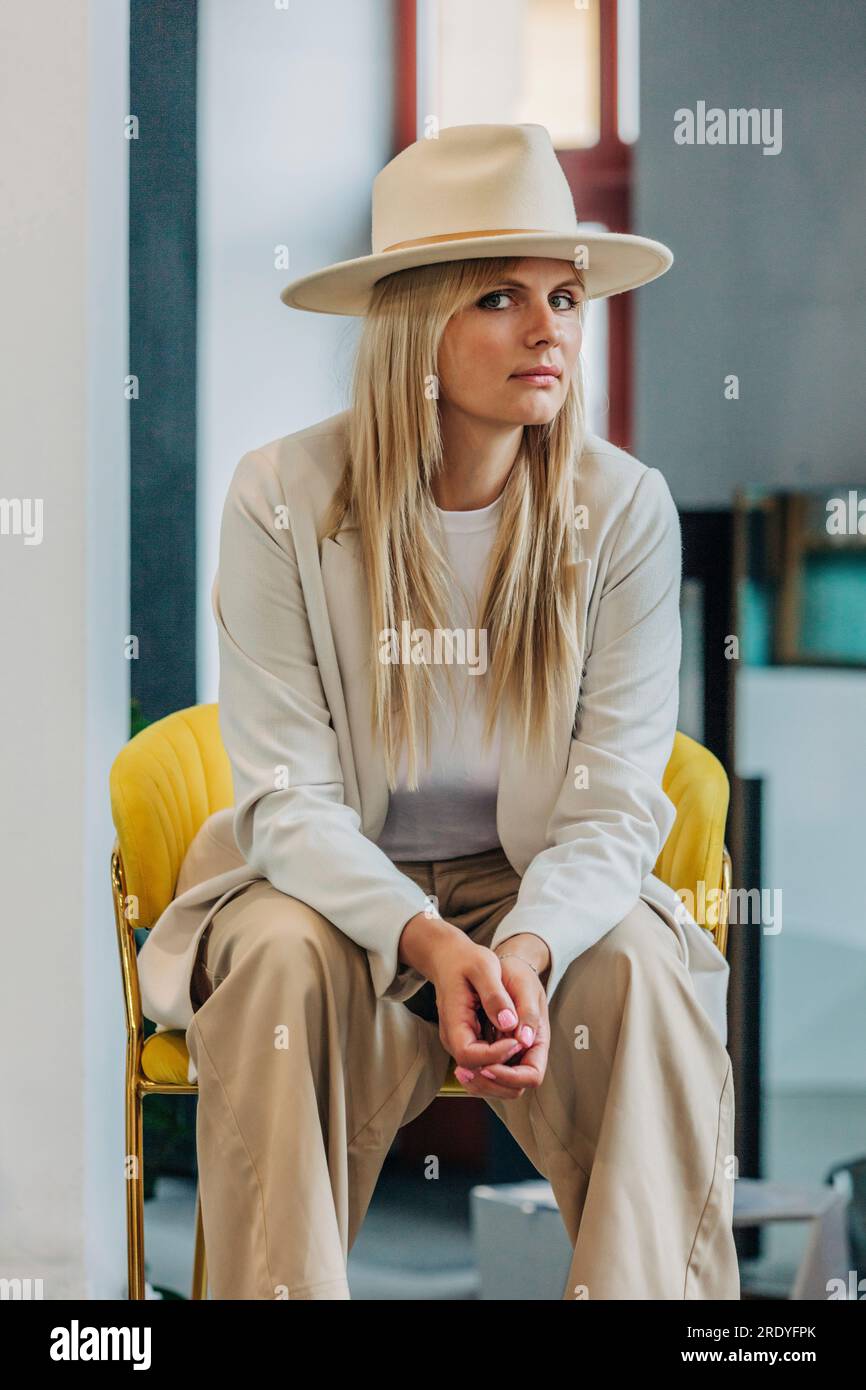 Beautiful woman sitting chair hi-res stock photography and images - Alamy