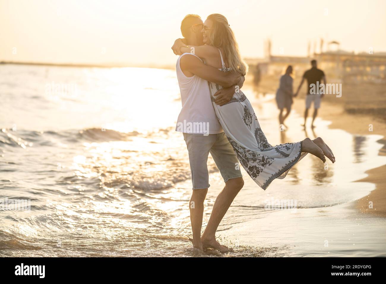 couple hugging on the beach