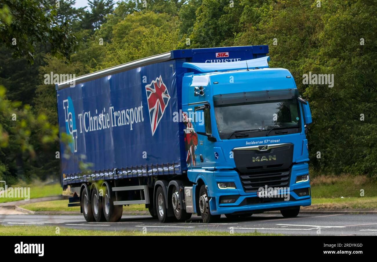 Milton Keynes,UK - July 21st 2023: 2020 blue MAN 3 axle + 3 axle artic lorry driving on an English road Stock Photo