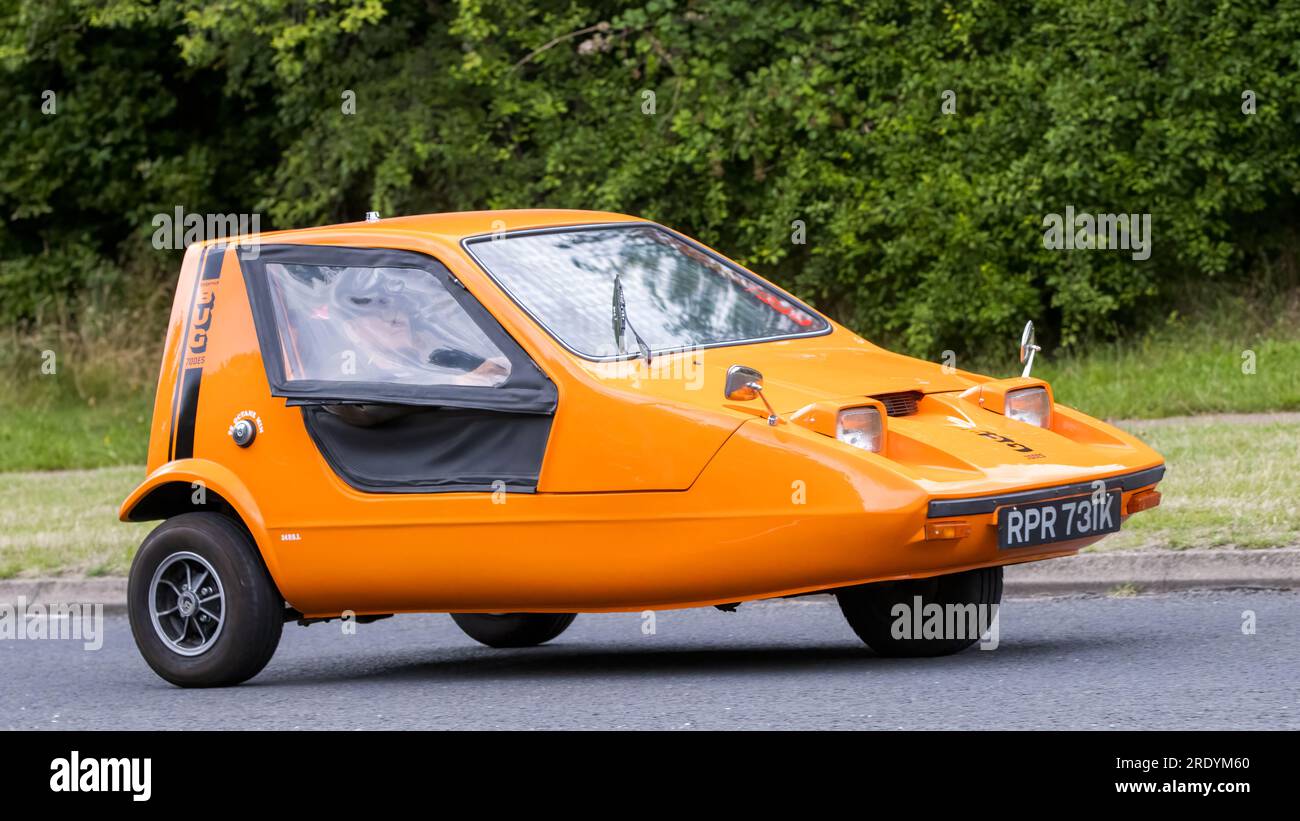 Milton Keynes,UK July 21st 2023 1972 orange Bond Bug three wheel car