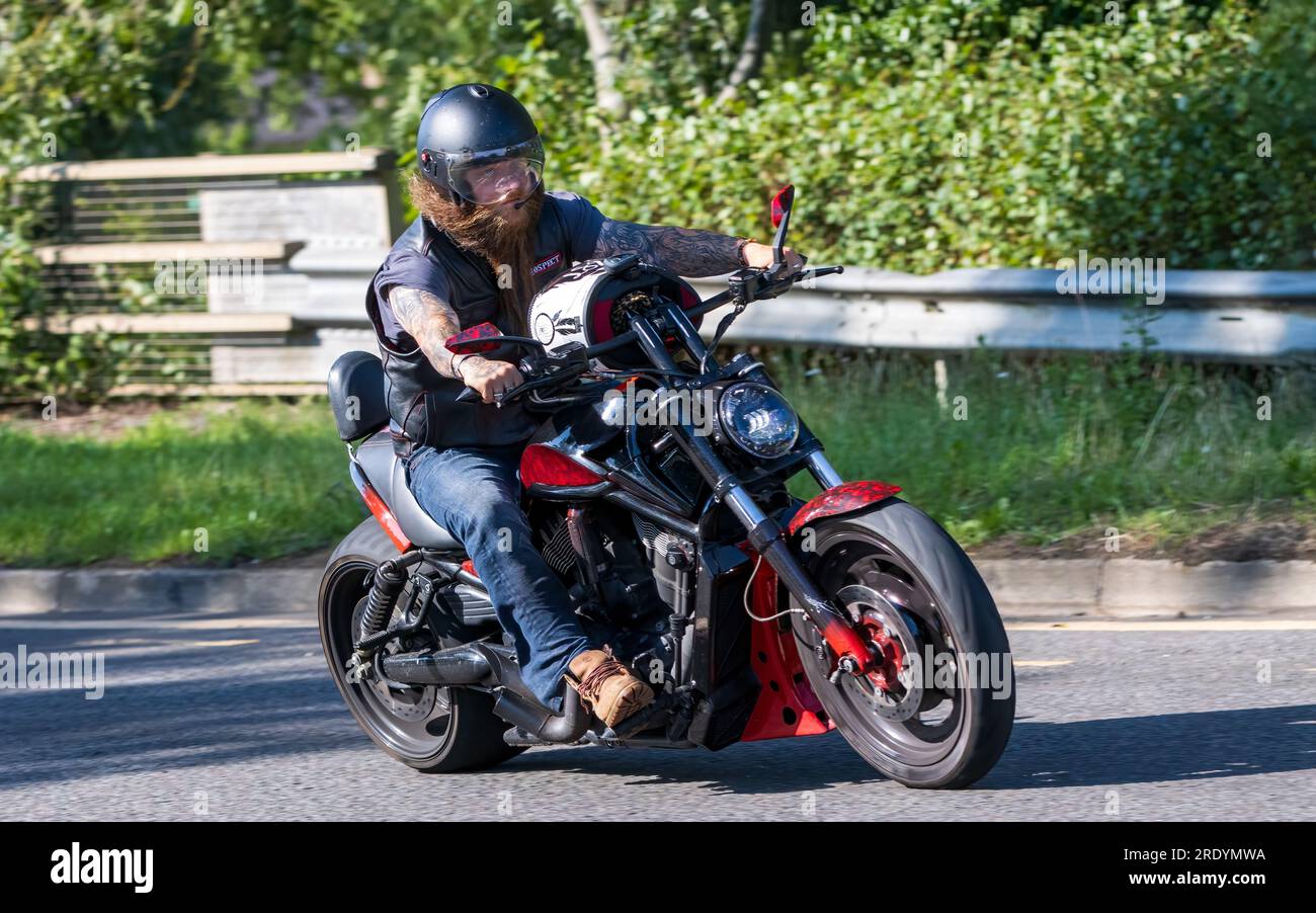 Milton Keynes,UK - July 23rd 2023:  Man riding a Harley Davidson motorcycle on an English road Stock Photo