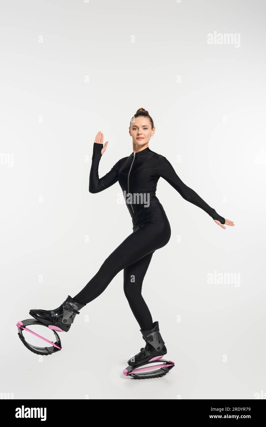 kangoo jumping fitness women team in boots. close up shot with blurred  background. black and pink colours boots. fitness training concept Stock  Photo - Alamy