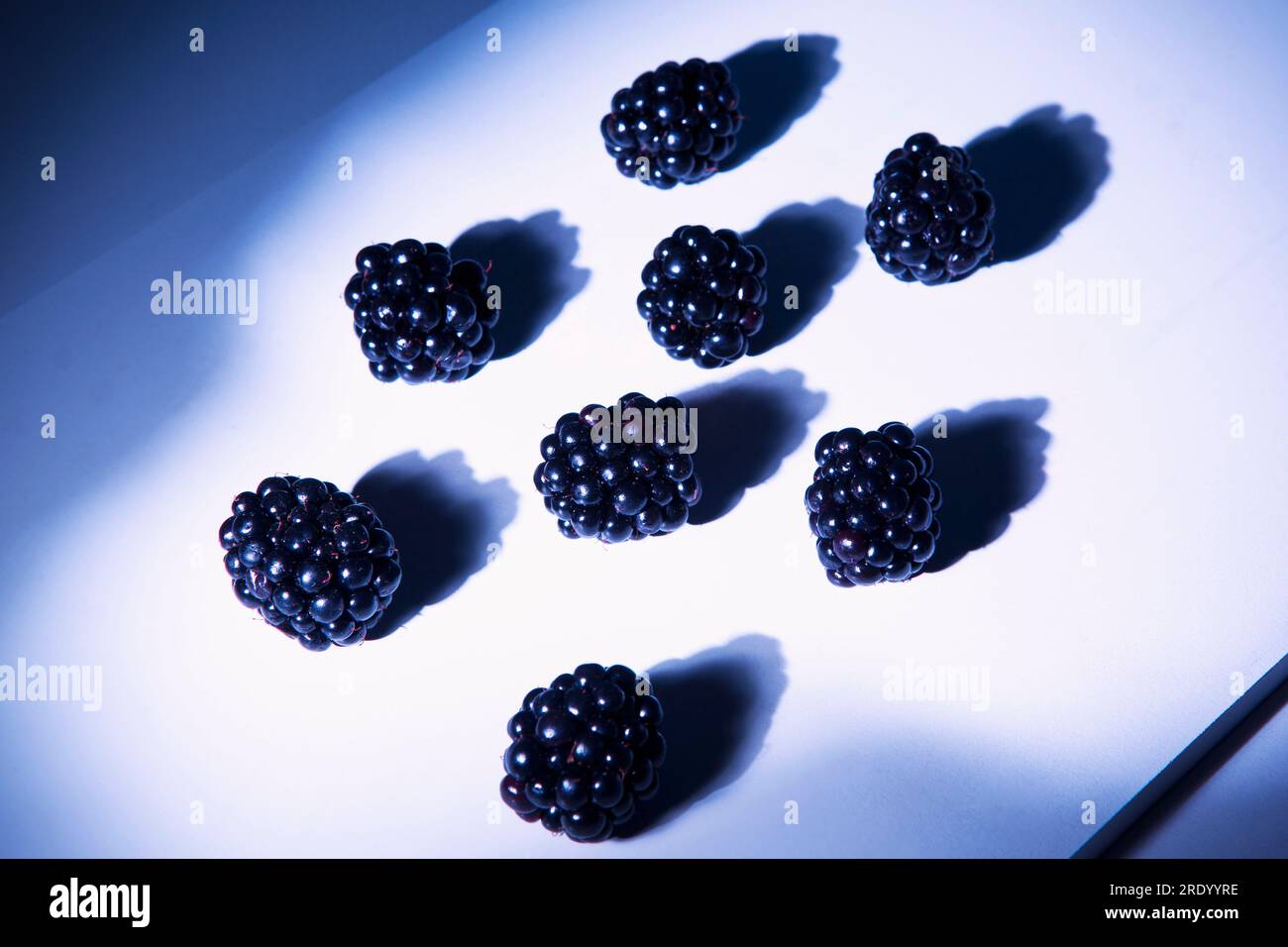 Blackberries lying on cutting board Stock Photo