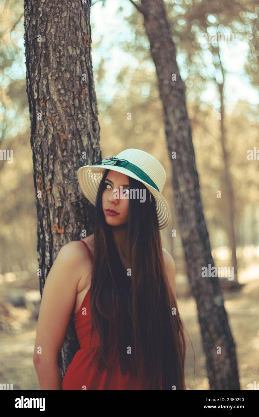 A young woman spending time in a forest Stock Photo