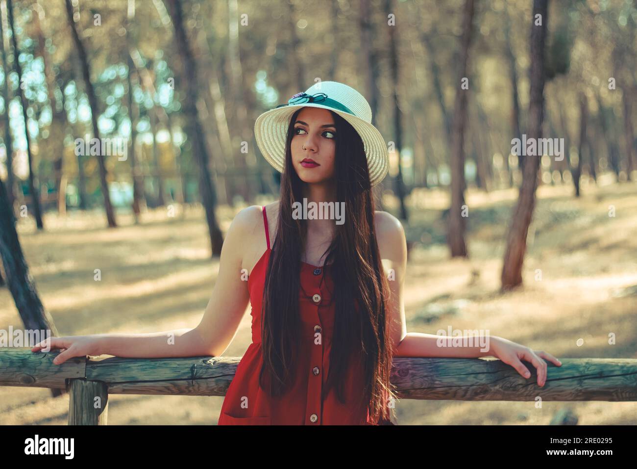 A young woman enjoying a time by herself in a forest Stock Photo
