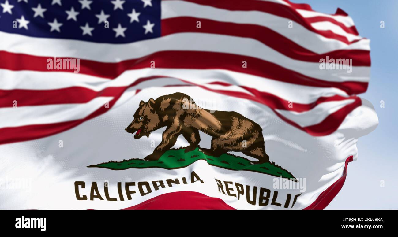 California state flag and the American flag waving in the wind, featuring a brown bear and the words “California Republic”. 3d illustration render. Fl Stock Photo