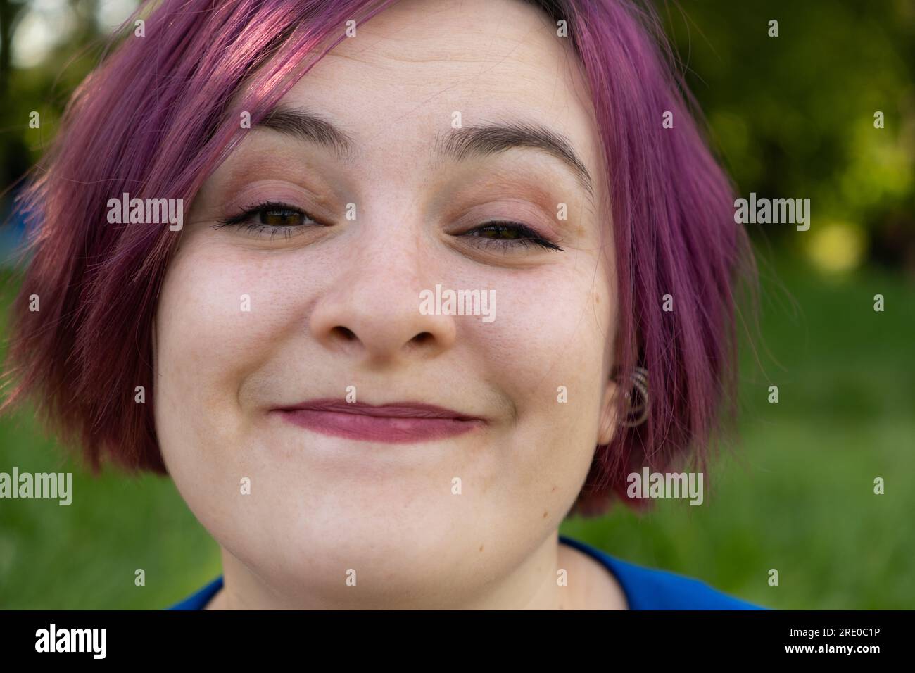 Portrait of cute smiling gothic girl on the roof at sunset time. Pastel goth  with violet (purple) hair in black clothes Stock Photo - Alamy