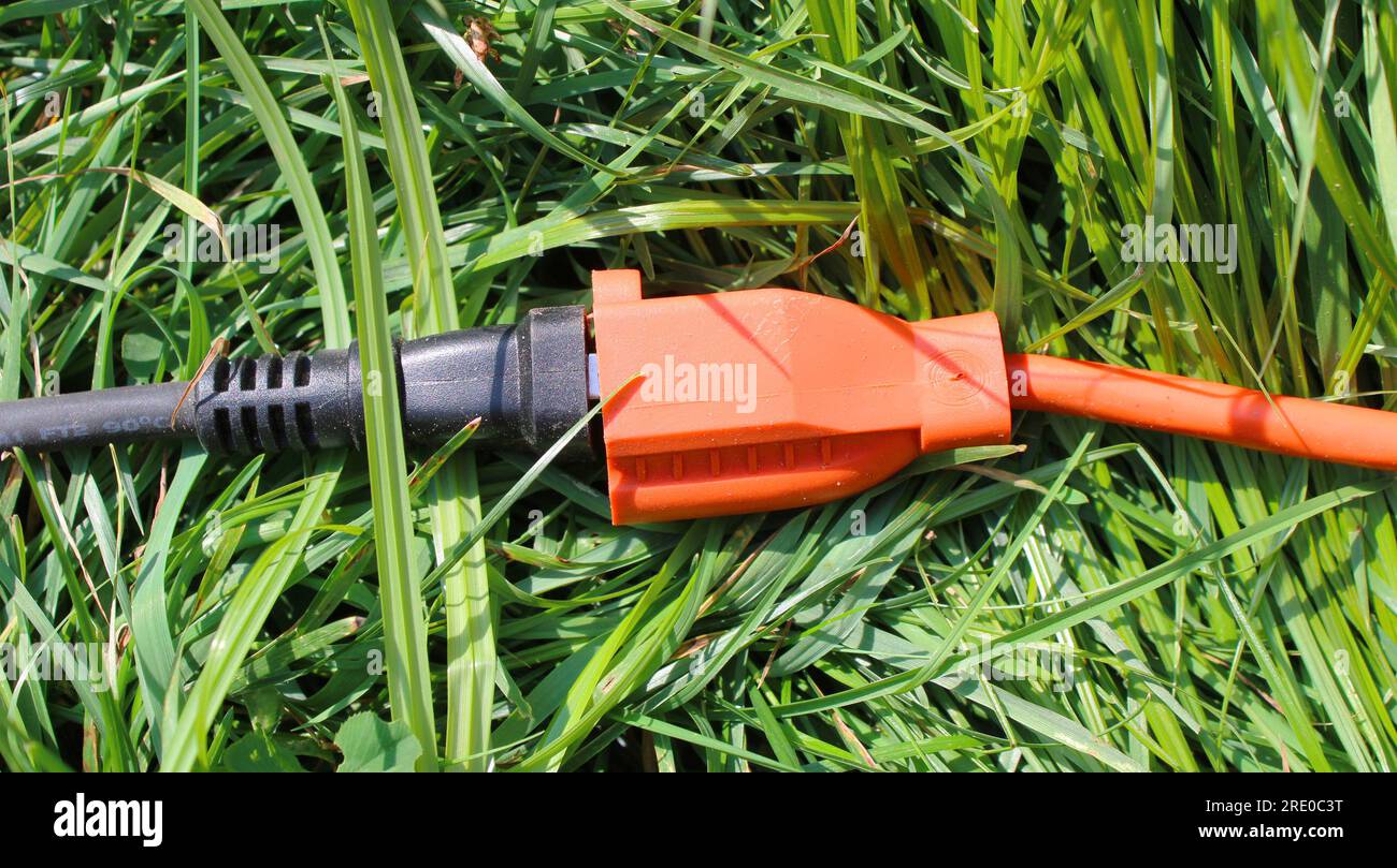 A Connection Between an Extension Cord and an Electrical Plug Oudoors
