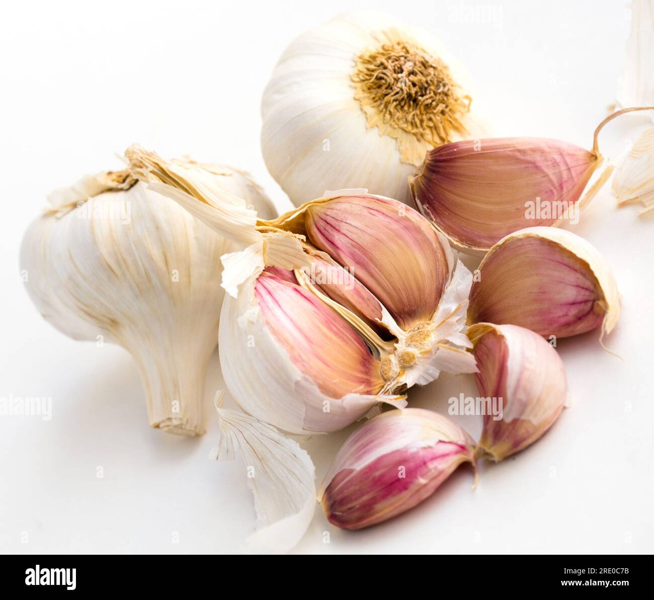 Garlic heads and cloves on white background Stock Photo - Alamy