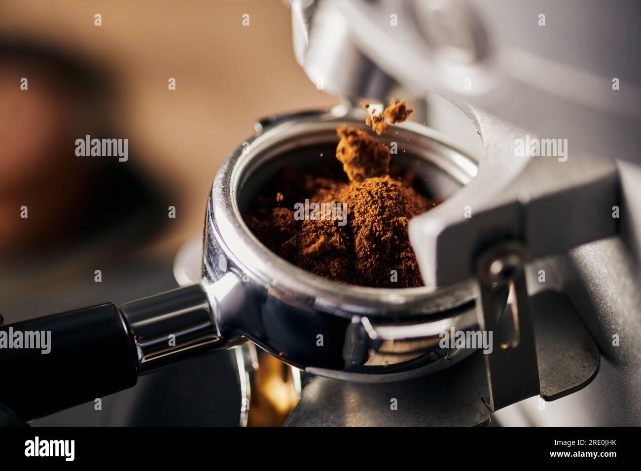 preparation of espresso, grinded coffee in portafilter, coffee machine