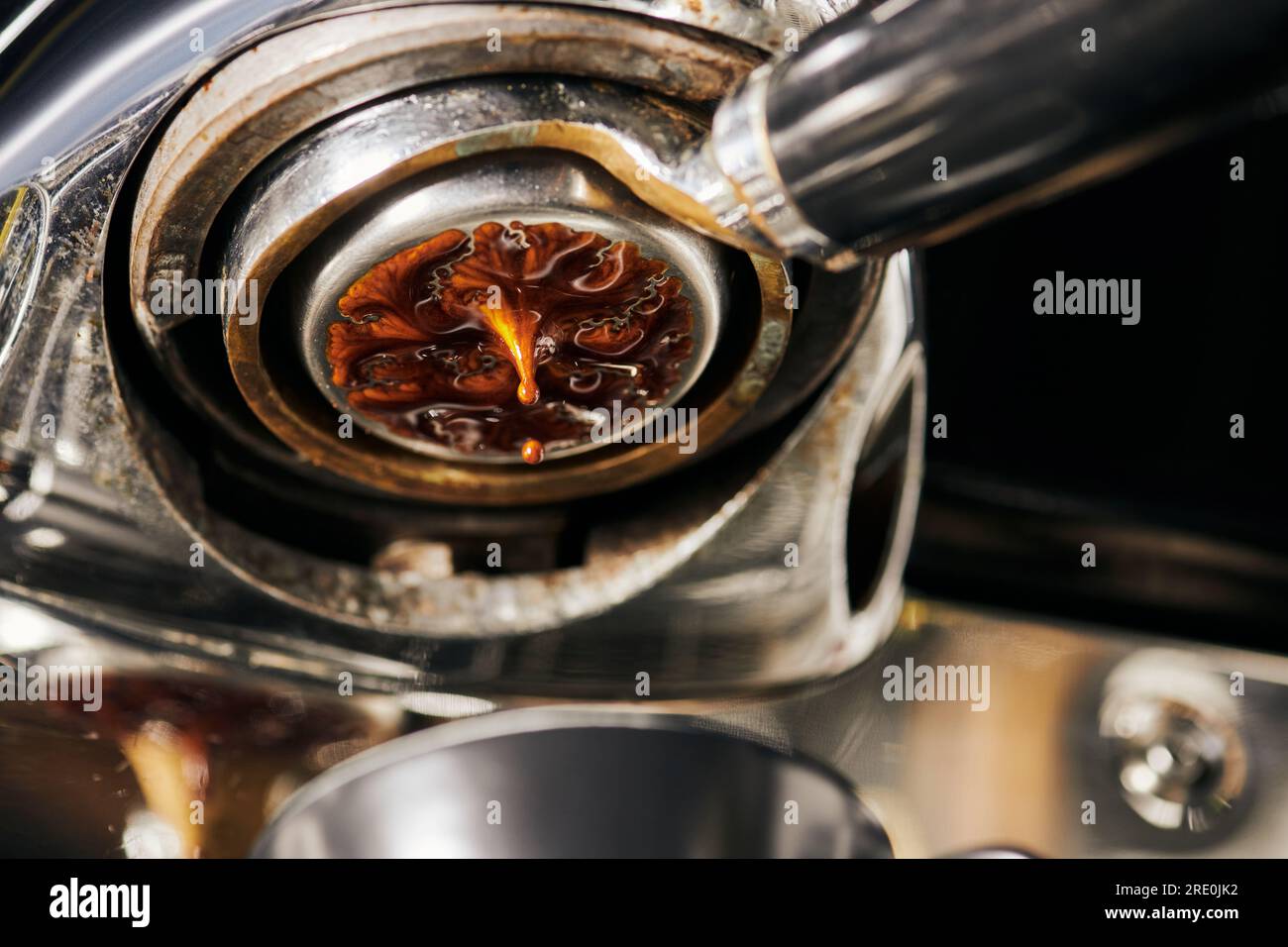 black coffee, extraction, hot espresso dripping into cup, professional