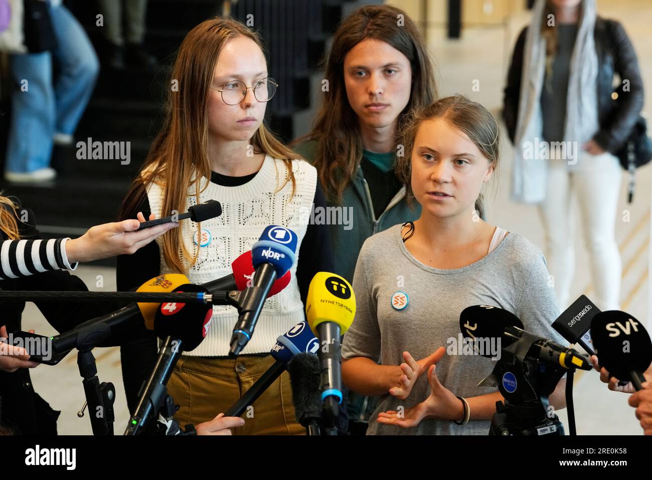 Climate activists Greta Thunberg, right, Elvin Landaeus Csizmadia, centre,  and Irma Kjellstrom, speak to the media after a hearing in a court in  Malmo, Sweden, Monday, July 24, 2023. Thunberg was found