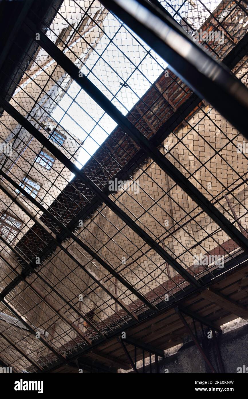 KGB Museum interior in The Corner House. The exercise yard or courtyard where arrested Latvians could vent. Roofed over with bars and fencing Stock Photo