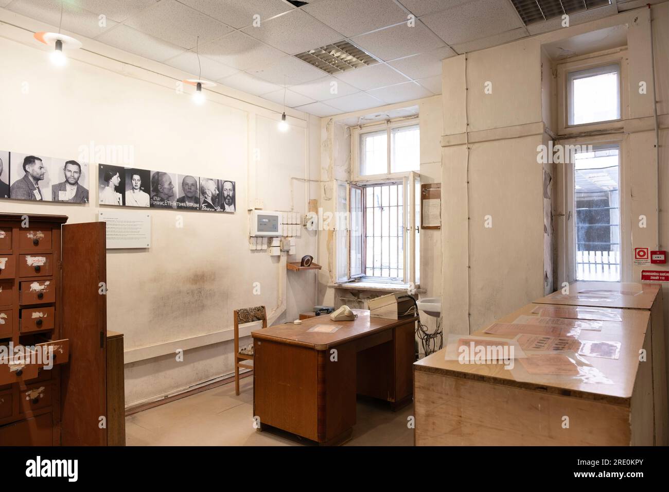 KGB Museum interior in The Corner House. Interrogation room and administrative office with pictures of arrested Latvians on the wall Stock Photo
