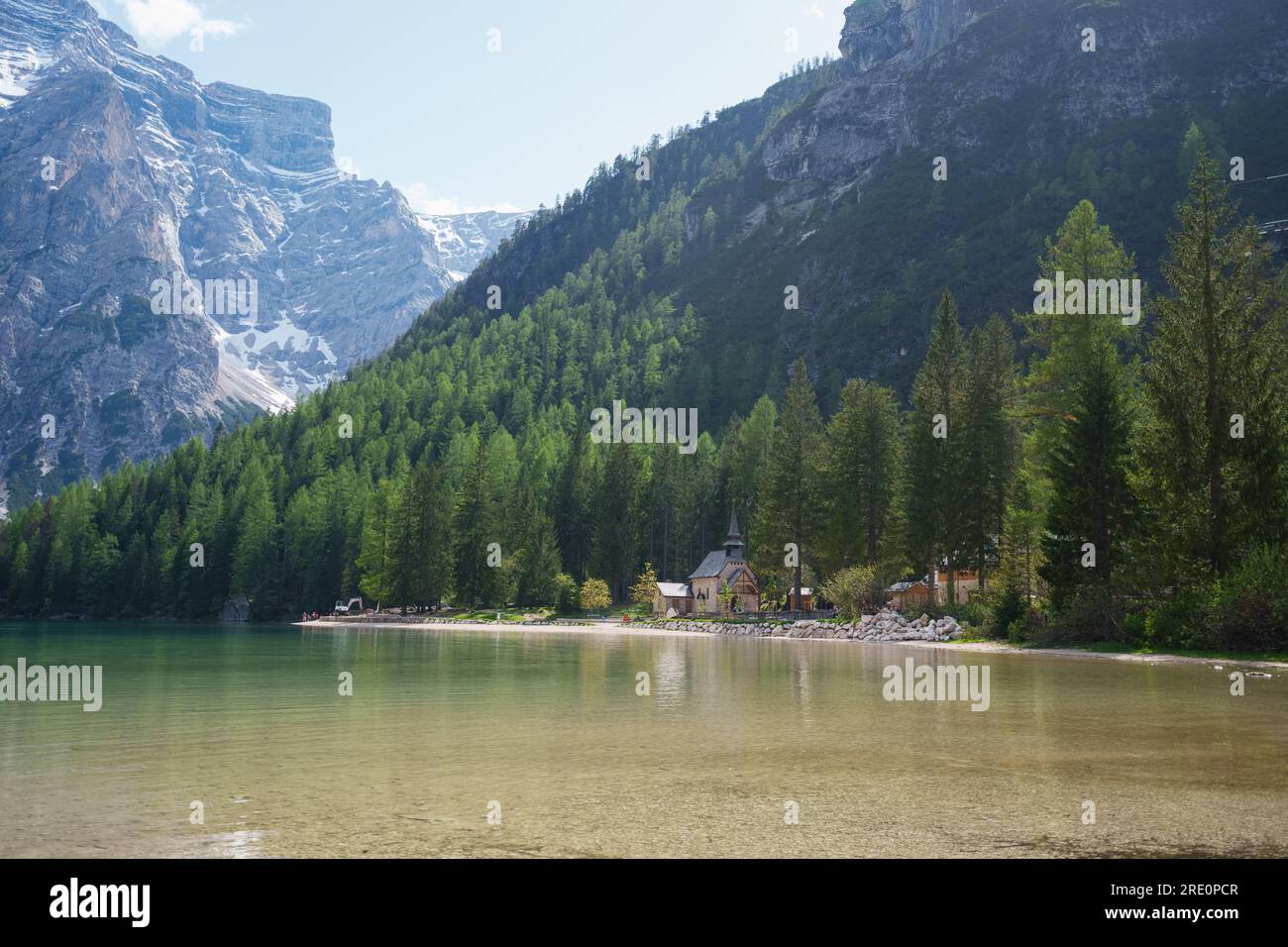 The lake is clear, sometimes green, sometimes blue, and surrounded by