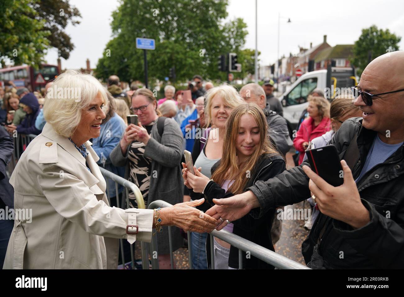 Queen Camilla shakes hands with a members of the public during a visit to Redwings Horse Sanctuary at Anna Sewell House in Great Yarmouth, while on a visit to Norfolk. Redwings Horse Sanctuary have been the custodians of Anna Sewell House since 2022. The House is the verified birthplace of Anna Sewell, author of Black Beauty. Picture date: Monday July 24, 2023. Stock Photo