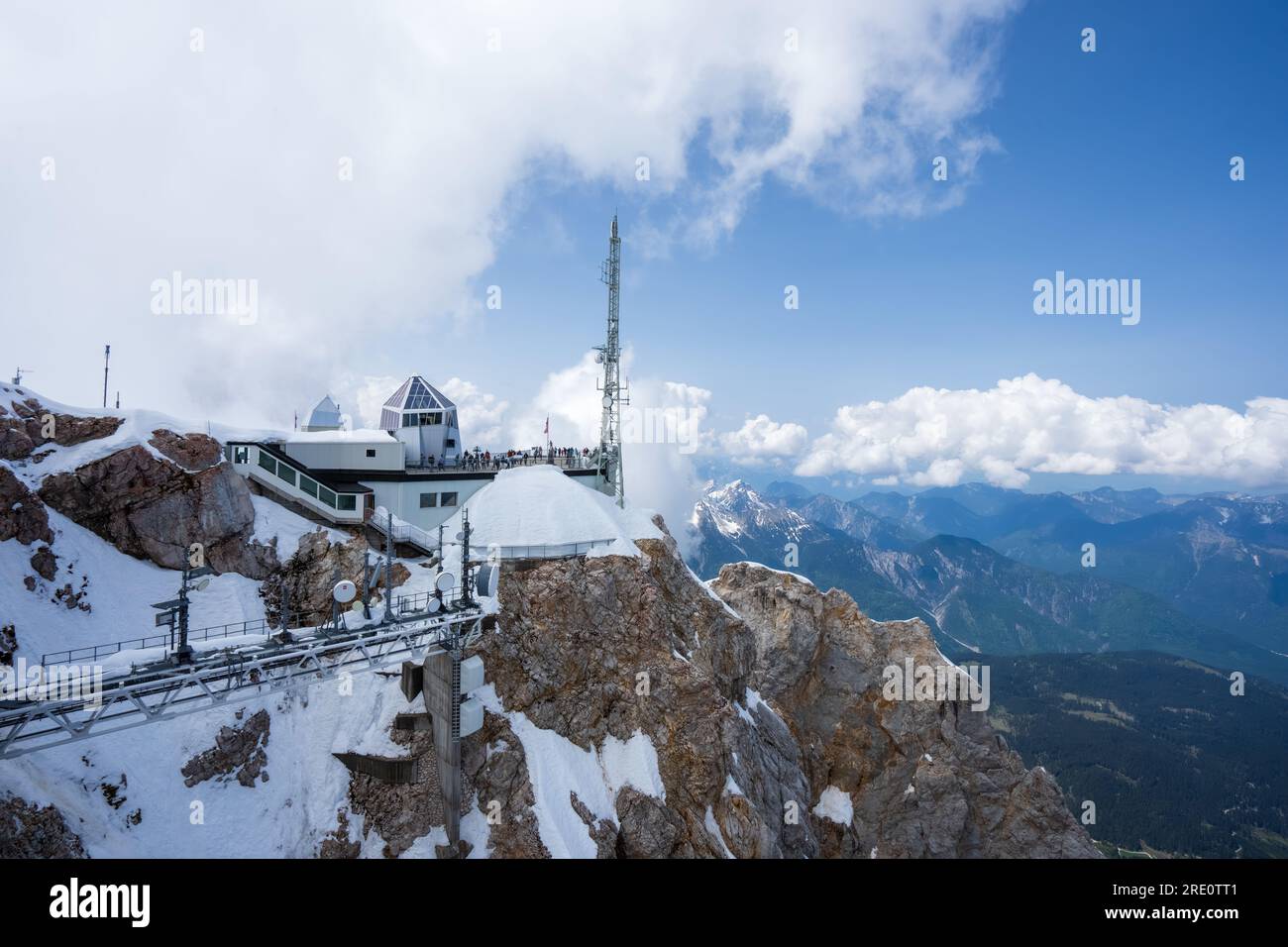 View of Zugspitze and cable car station in the Alps. The Zugspitze belongs to the Alps and is