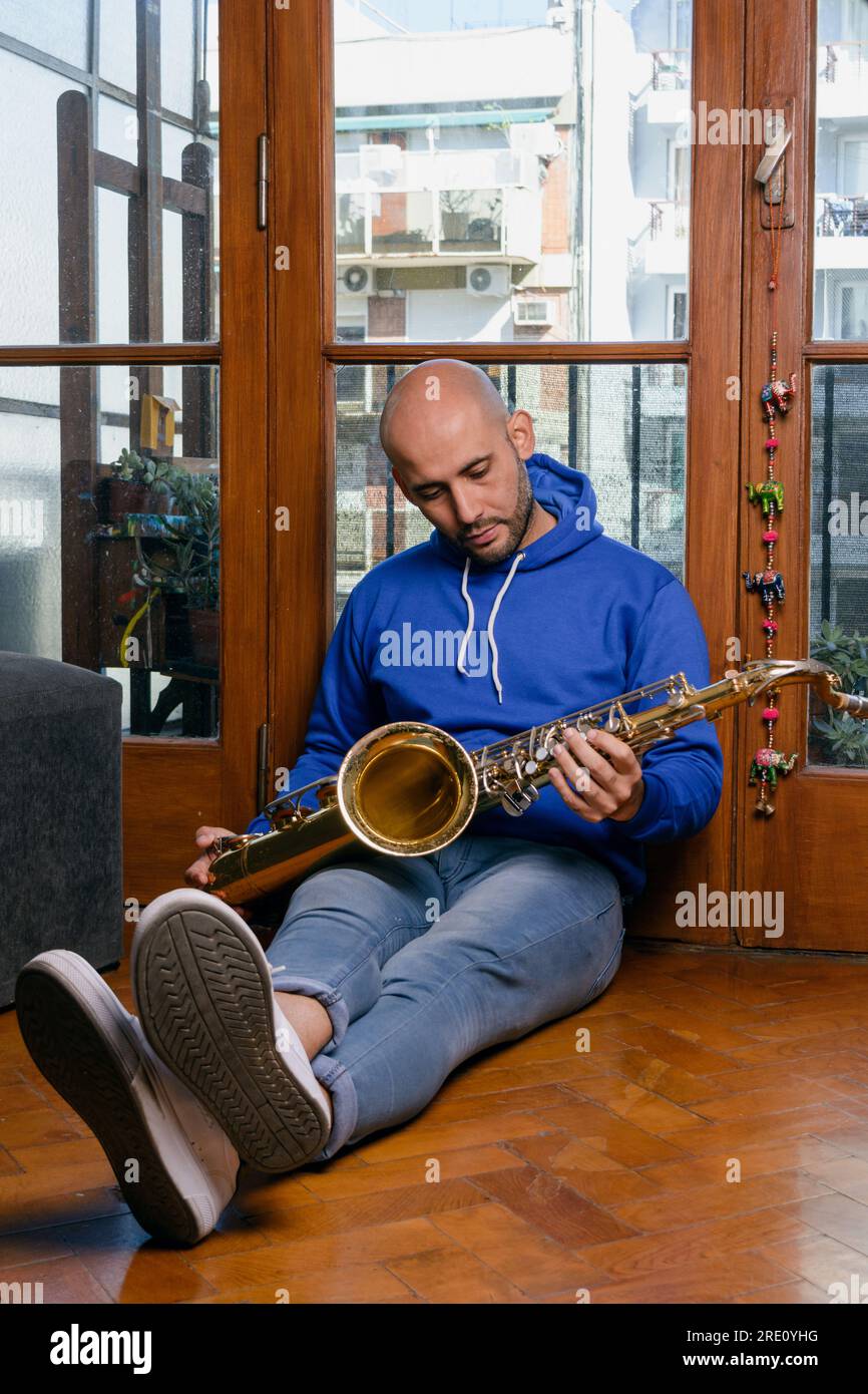 vertical portrait of a very calm and serene young Venezuelan, sitting