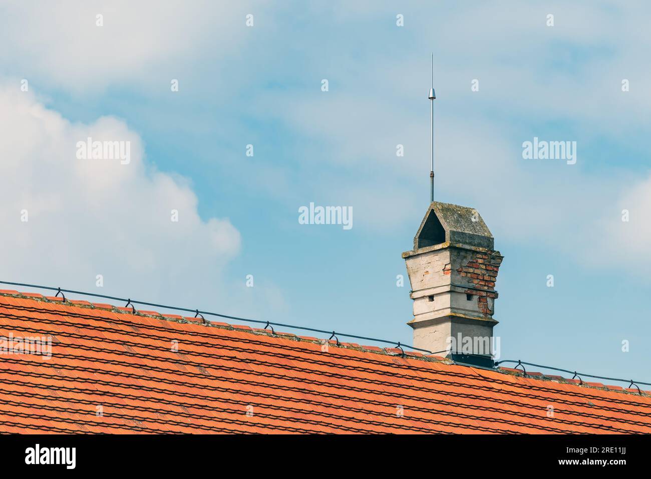 Chimney on the roof with lightning rod, selective focus Stock Photo Alamy