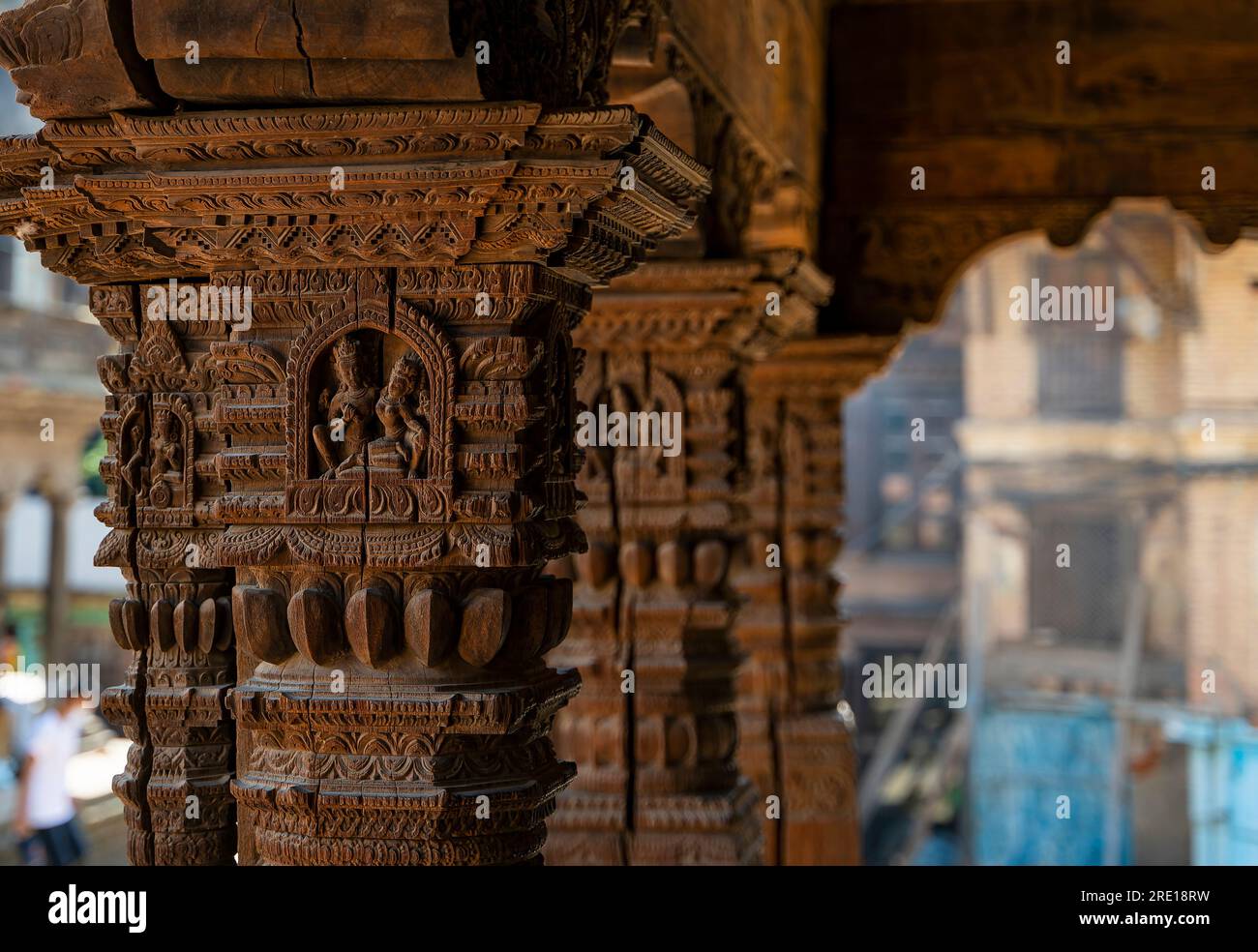 Wooden carved pillars and arch in the temple of Durbar square at Patan