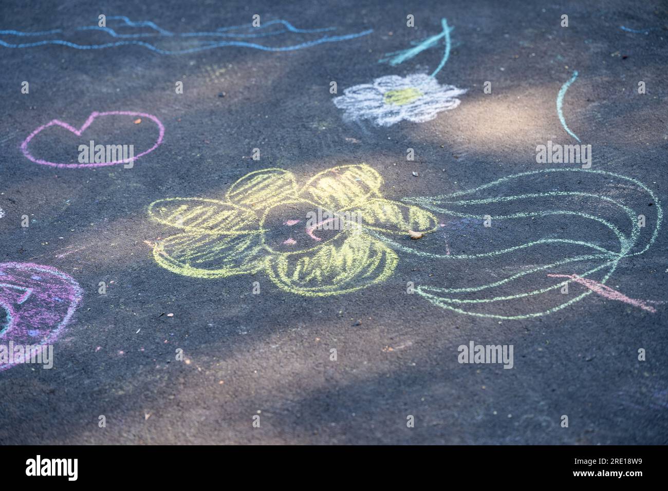 children s drawings with chalk on asphalt Stock Photo Alamy