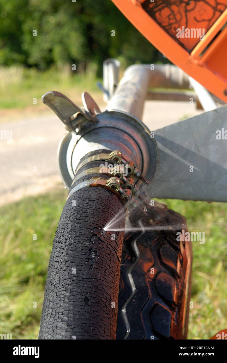 Irrigation, water leak on an automatic agricultural sprinkler hose