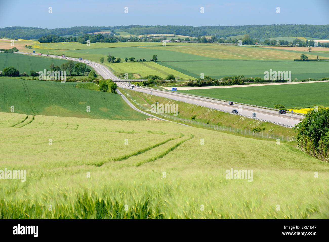 Highway A28 crossing the “pays de Bray” area. Motorway in the middle of wheat, barley and escurgeon fields Stock Photo
