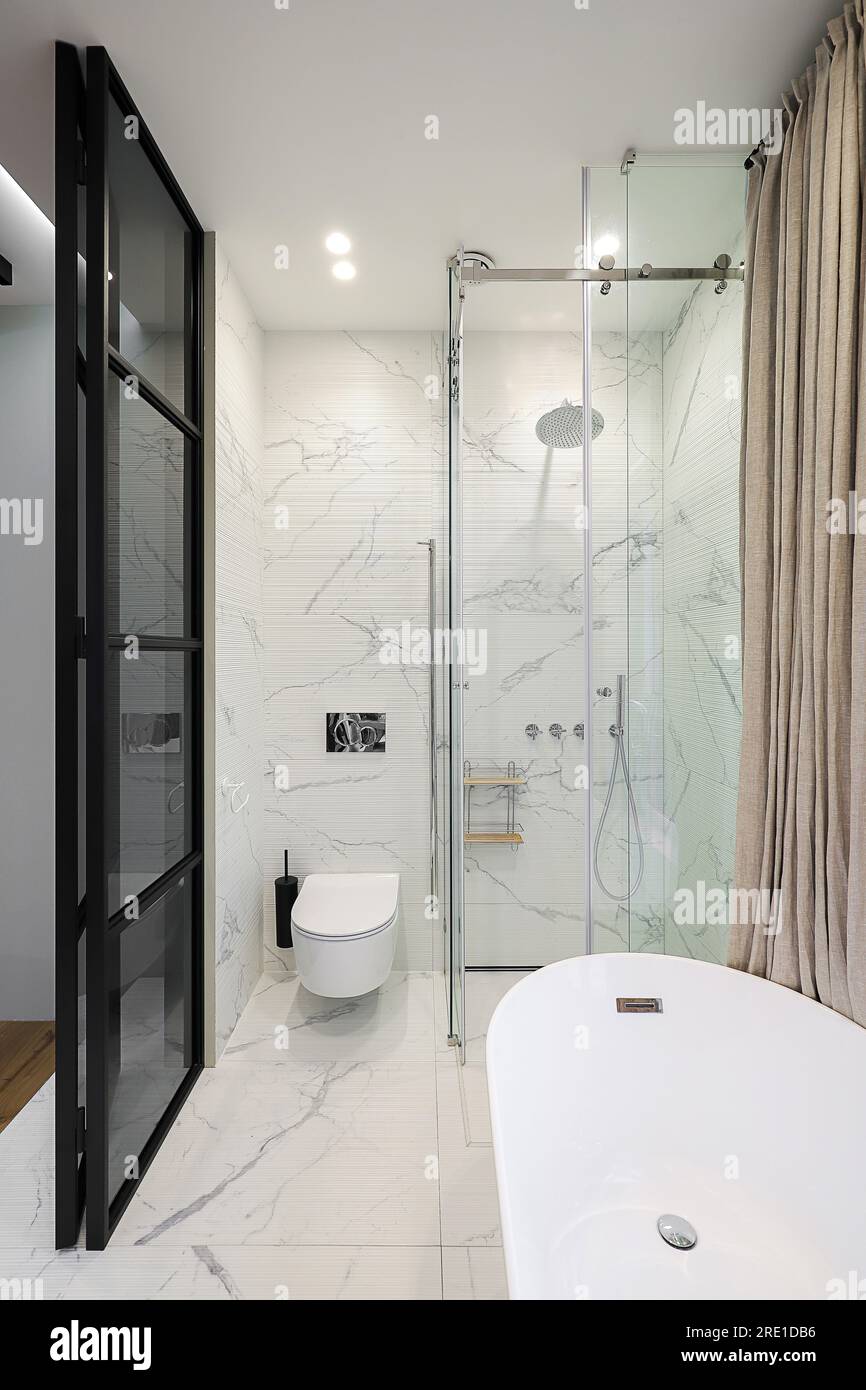 Modern bathroom interior with shower cabin and white toilet bowl Stock ...
