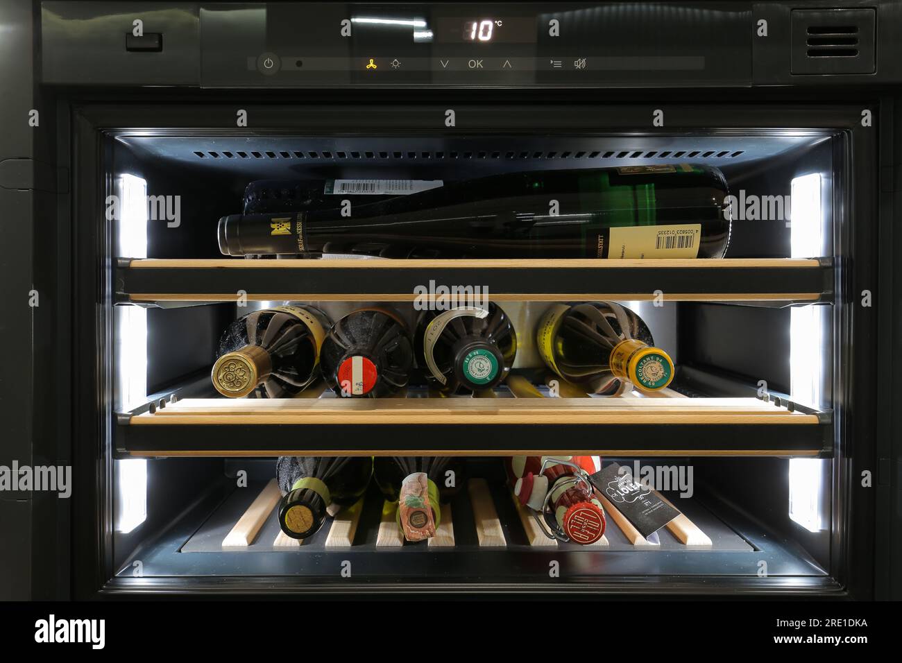 Bottles of wine in a home wine fridge Stock Photo