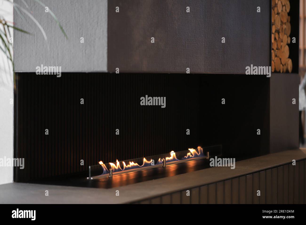 Burning modern eco bio ethanol fireplace in the living room Stock Photo