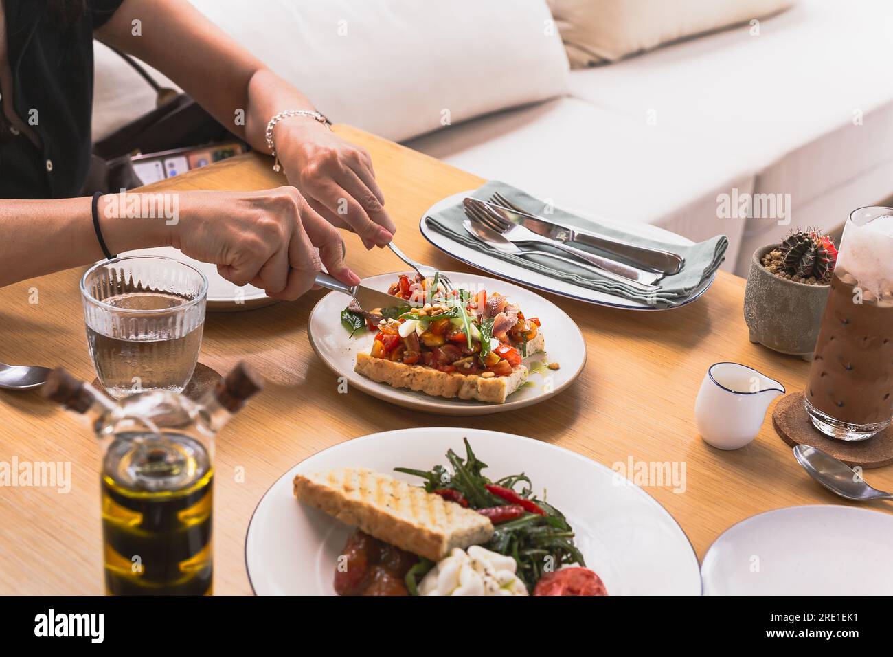 Hands hold fork knife hi-res stock photography and images - Alamy