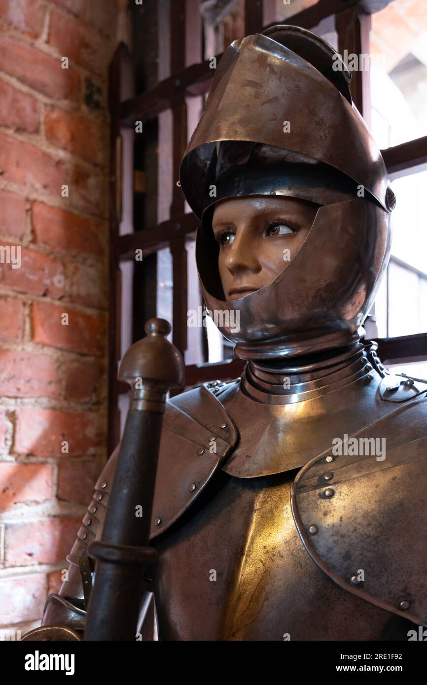 Fashion model of knight in armor wearing helmet at the Trakai History Museum in Lithuania Stock Photo