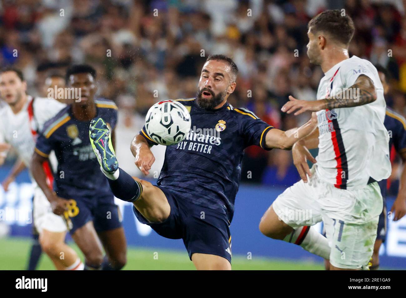 Los Angeles, United States. 23rd July, 2023. Real Madrid defender Dani Carvajal (L) and AC Milan forward Christian Pulisic (R) in action during a Soccer Champions Tour match between the AC Milan and Real Madrid FC in Pasadena. Final score: Real Madrid FC 3:2 AC Milan Credit: SOPA Images Limited/Alamy Live News Stock Photo