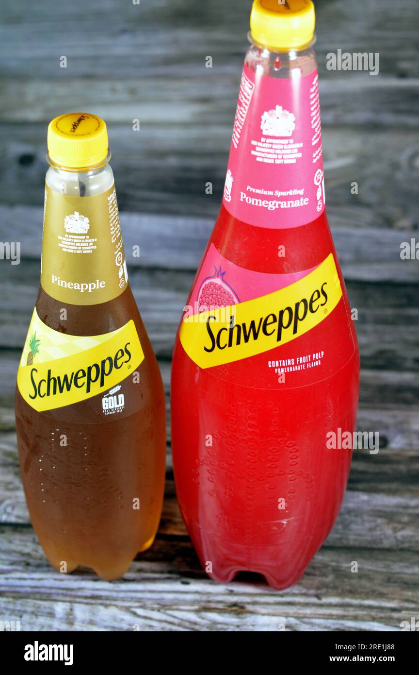 Giza, Egypt, July 21 2023:  Schweppes premium sparkling soft drink Gold pineapple and pomegranate flavors, Schweppes is a beverage brand that originat Stock Photo