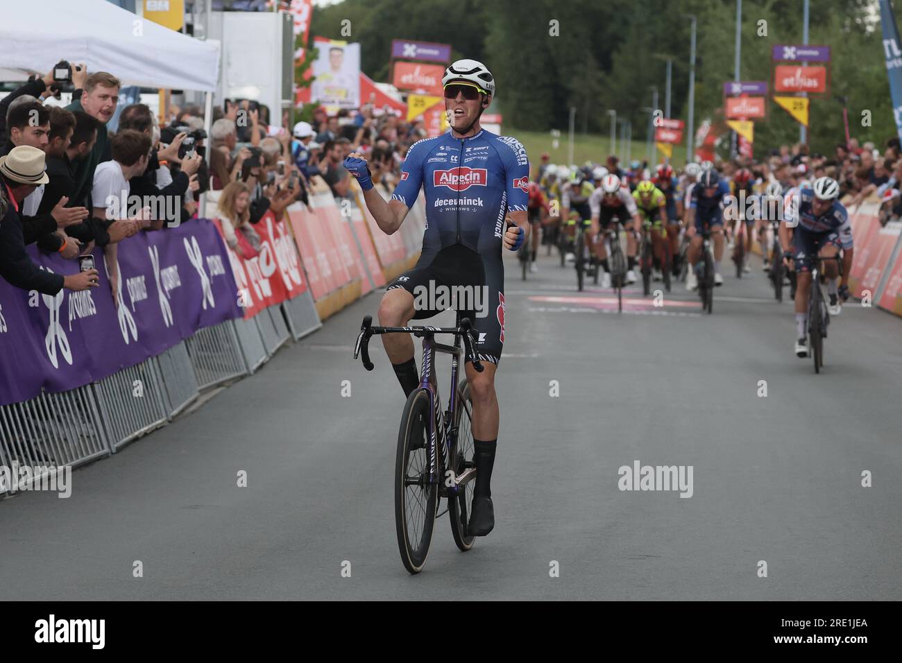 Mont Saint Guibert, Belgium. 24th July, 2023. Belgian Timo Kielich of  Alpecin-Deceuninck celebrates on the podium in the red jersey for best  young rider after stage 3 of the Tour De Wallonie