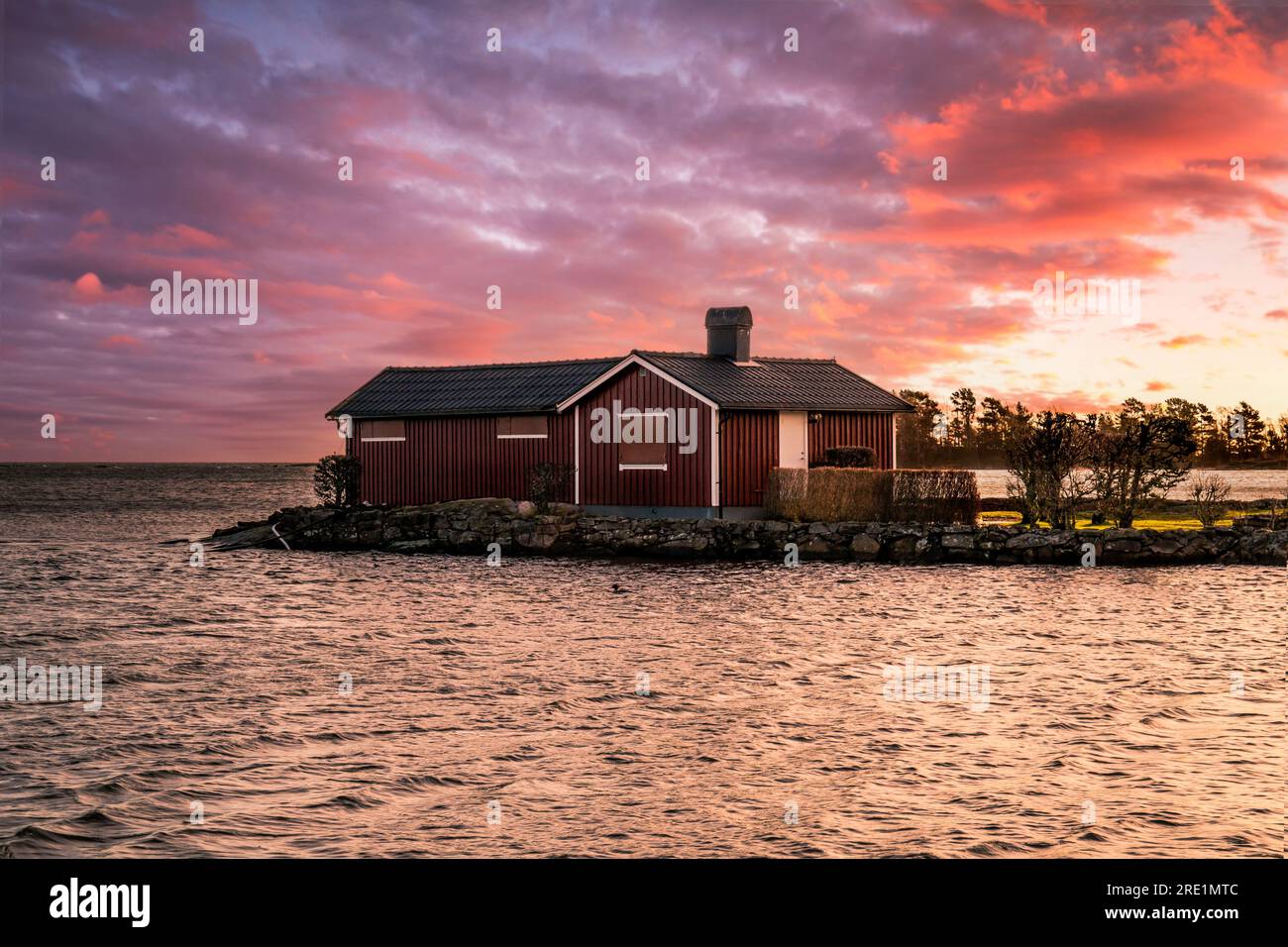 Sweden lake or Sweden sea, sunrise clouds and long exposure of a landscape shot in Scandinavia Sweden house Stock Photo