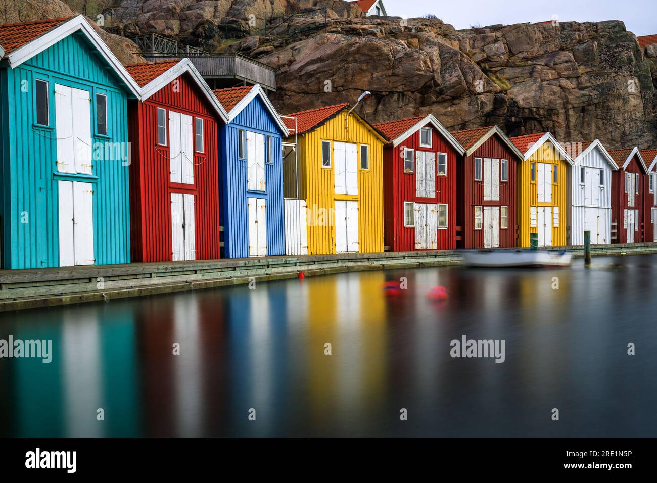 Sweden houses, small colorful fishermen's houses in Sweden smog. A great city right by the sea with a rock in the background, smögen Stock Photo