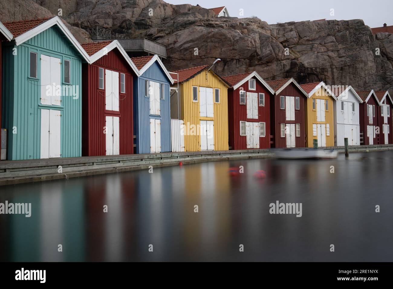 Sweden houses, small colorful fishermen's houses in Sweden smog. A great city right by the sea with a rock in the background, smögen Stock Photo