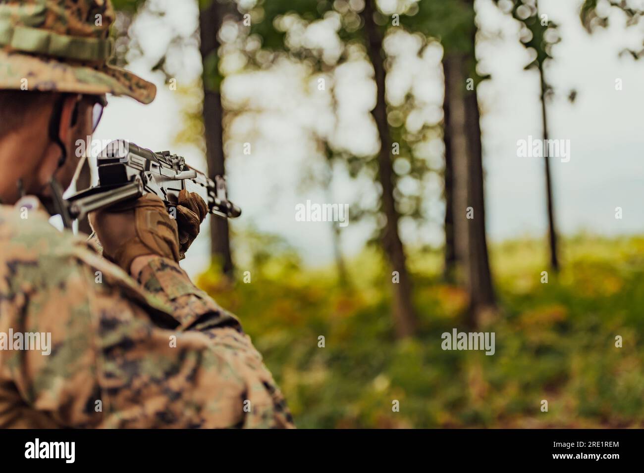 A modern warfare soldier on war duty in dense and dangerous forest ...