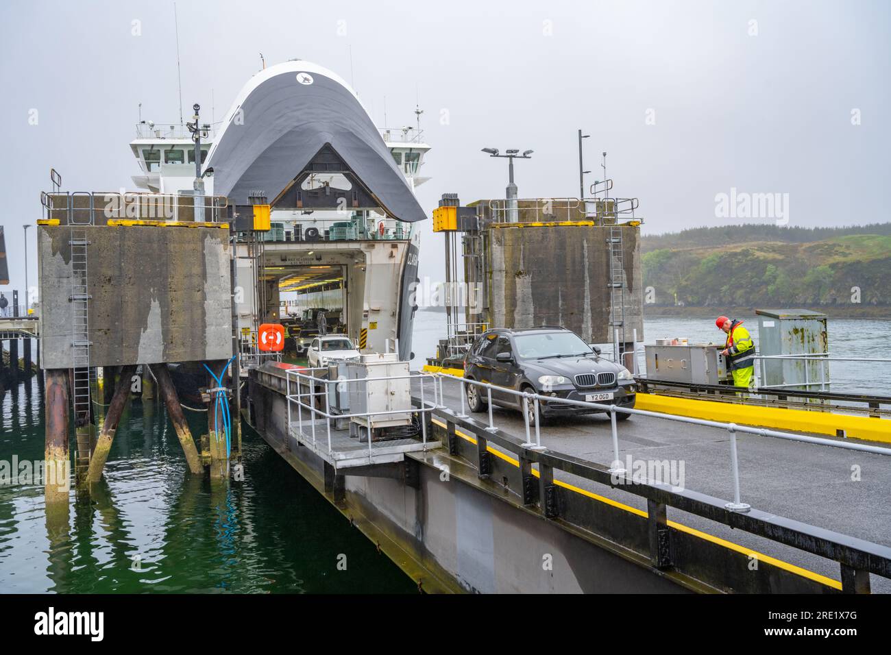Car disembarking from the CalMac ferry Clansman in the harbour at Tarbert The Isle of Harris on a foggy morning Stock Photo