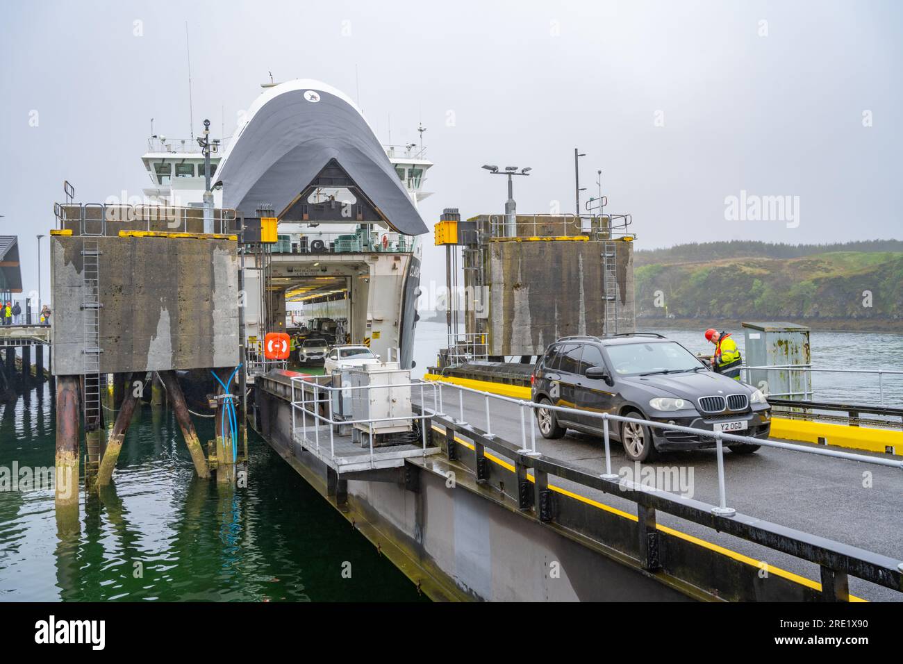 Car disembarking from the CalMac ferry Clansman in the harbour at Tarbert The Isle of Harris on a foggy morning Stock Photo