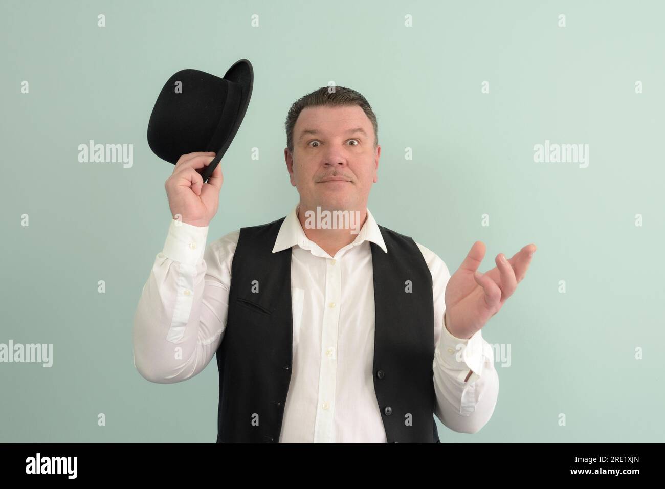 A man from the past, a portrait on a light background. Bowler hat ...