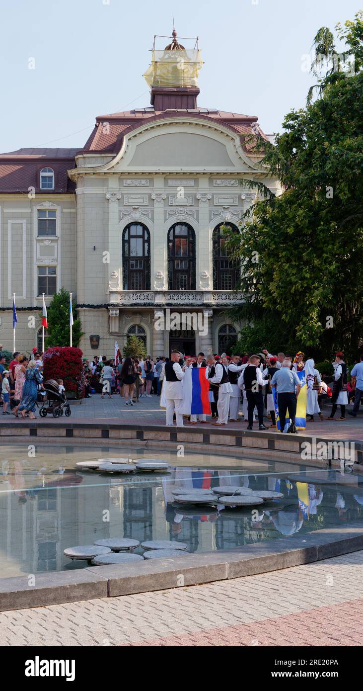 Cultural event as youngsters from around the world in traditional costume meet and perform. Beside Town Hall, Plovdiv, Bulgaria, July 24, 2023. Stock Photo