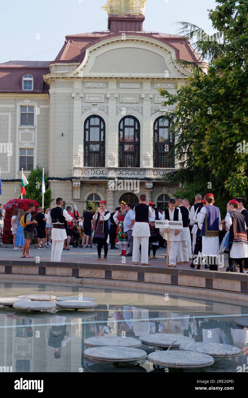 Cultural event as youngsters from around the world in traditional costume meet and perform. Beside Town Hall, Plovdiv, Bulgaria, July 24, 2023. Stock Photo
