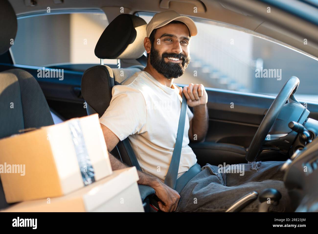 Arab Guy Putting Seat Belt In Car Working As Courier Stock Photo Alamy