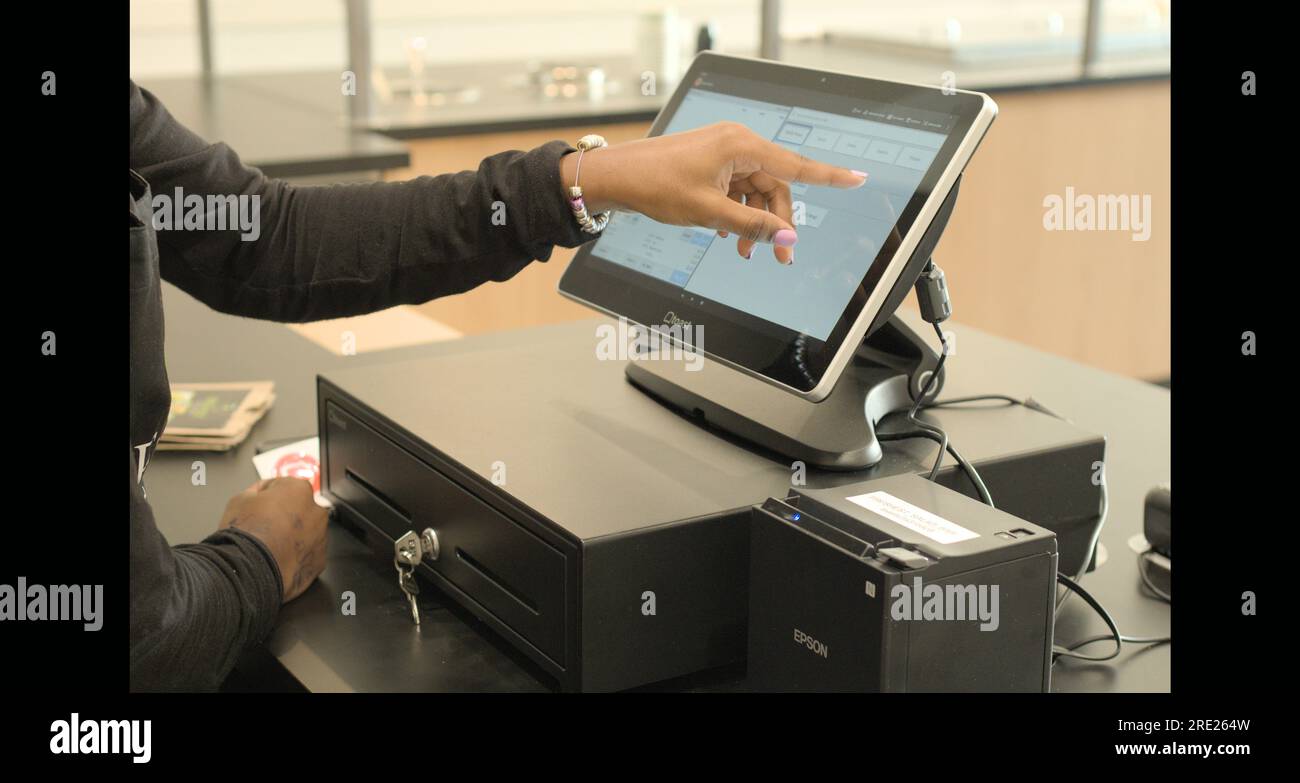 Using POS cash register system checkout Stock Photo