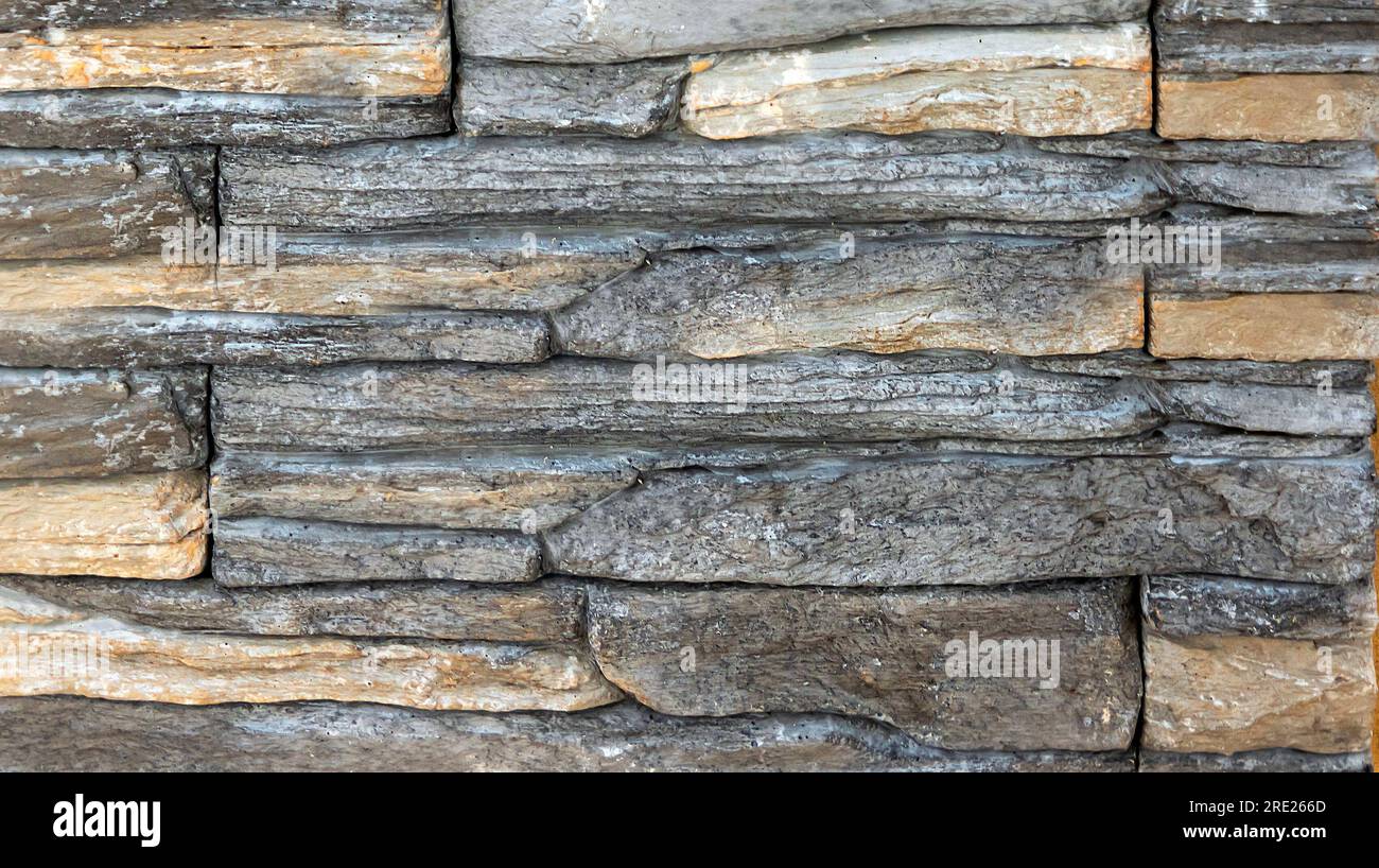 Old rough stone wall facade pattern texture background Stock Photo - Alamy