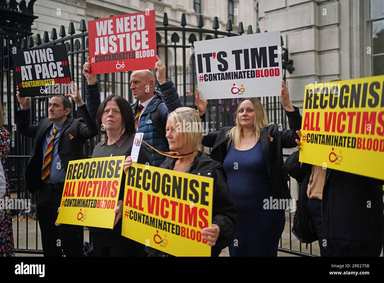 People demonstrate as relatives of victims of the NHS infected blood scandal hand in a letter to